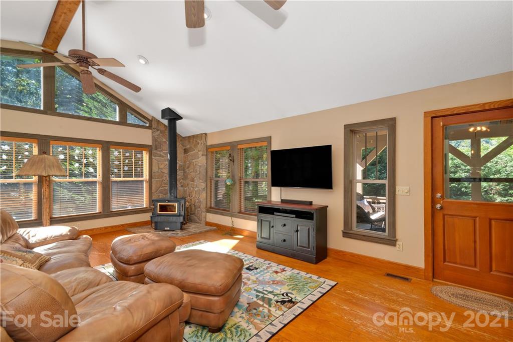 243 Rivermont Drive Canton, NC 28716 - Photo 9 of 29 a living room with furniture and a flat screen tv