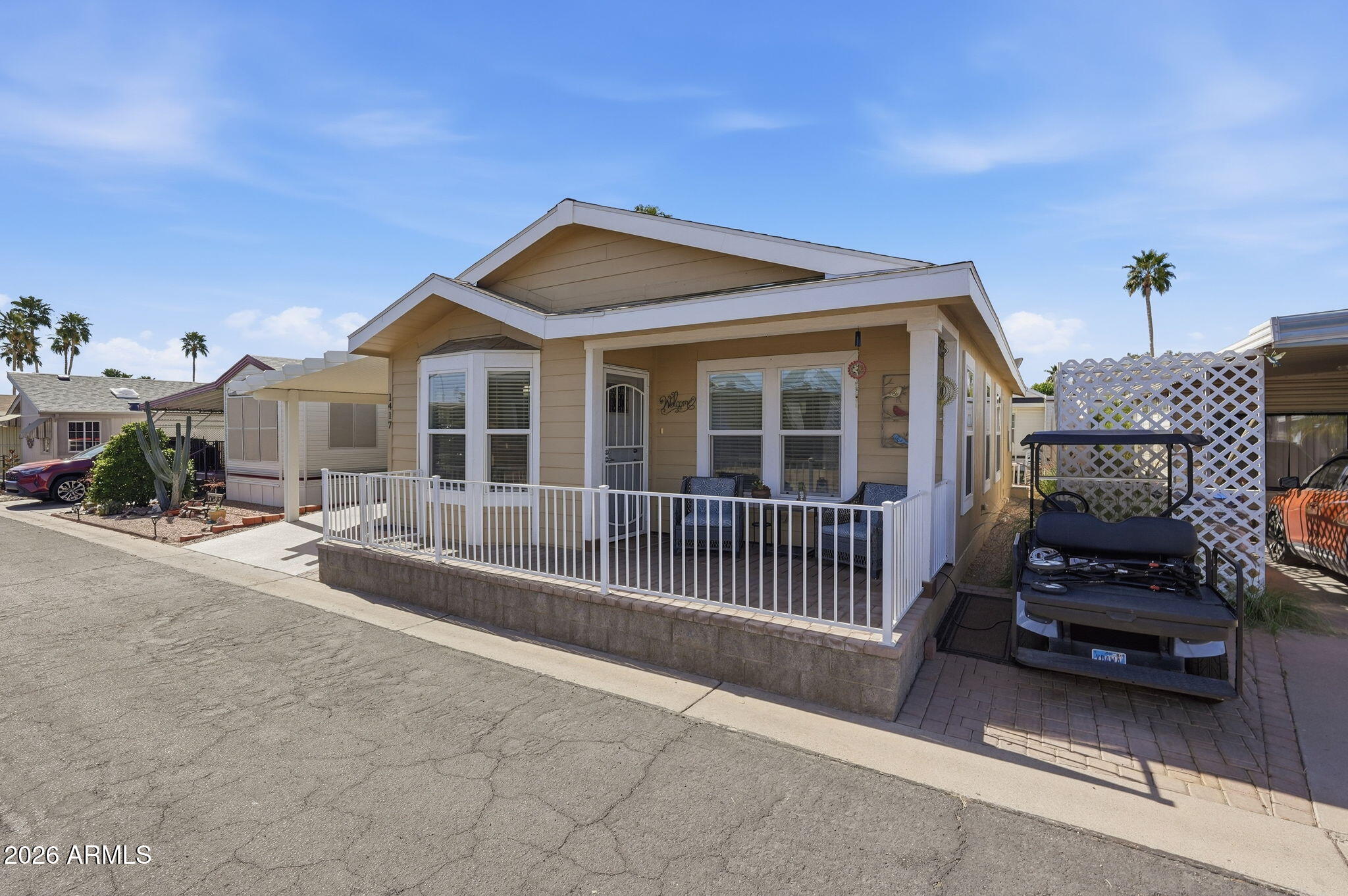 8865 East Baseline Road, Unit 1417 Mesa, AZ 85209 - Photo 6 of 47 a view of a house with a balcony and parking space