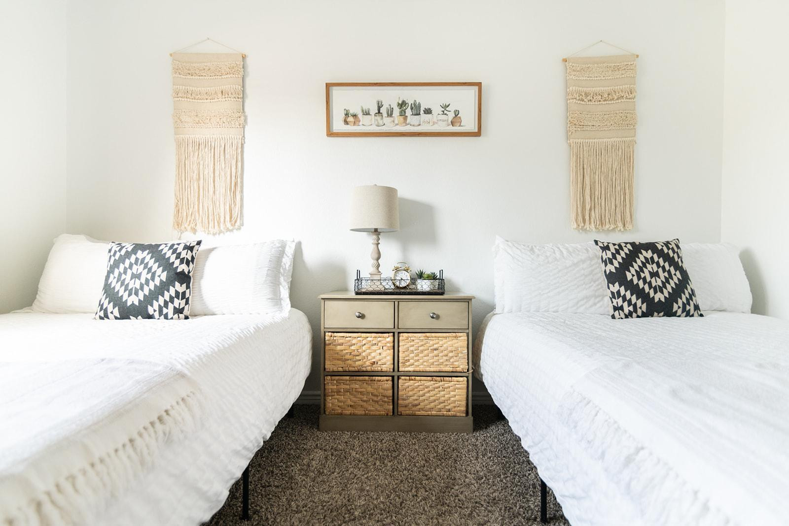 7435 East Granada Road Scottsdale, AZ 85257 - Photo 26 of 28 a bedroom with a bed and a lamp