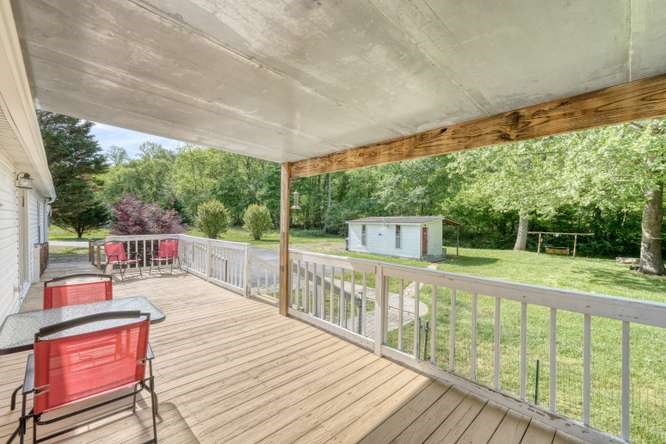 5359 Owltown Road Blairsville, GA 30512 - Photo 14 of 52 a view of a balcony with mountain view and wooden floor