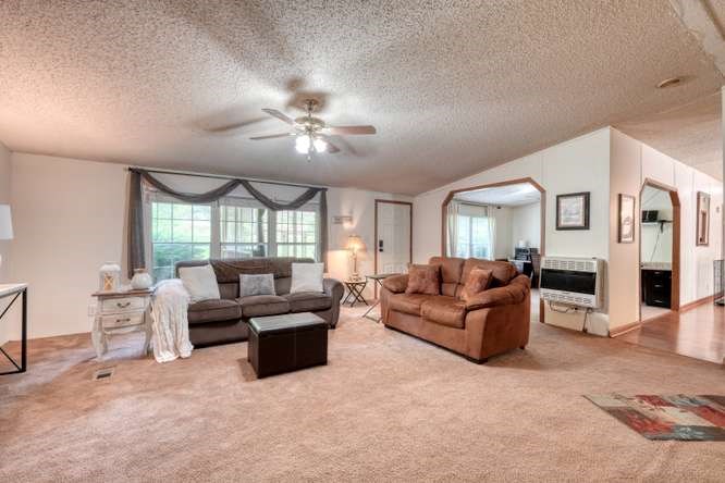 5359 Owltown Road Blairsville, GA 30512 - Photo 16 of 52 a living room with furniture fireplace and flat screen tv