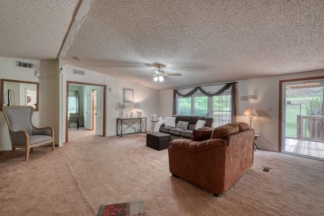 5359 Owltown Road Blairsville, GA 30512 - Photo 17 of 52 a living room with furniture and a large window