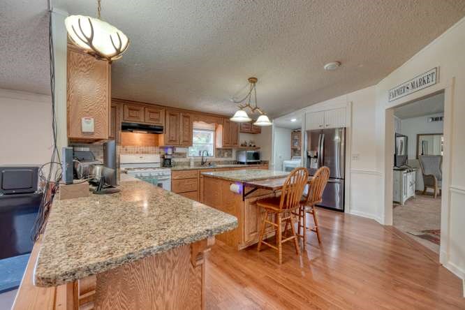5359 Owltown Road Blairsville, GA 30512 - Photo 18 of 52 a kitchen with a table and chairs in it