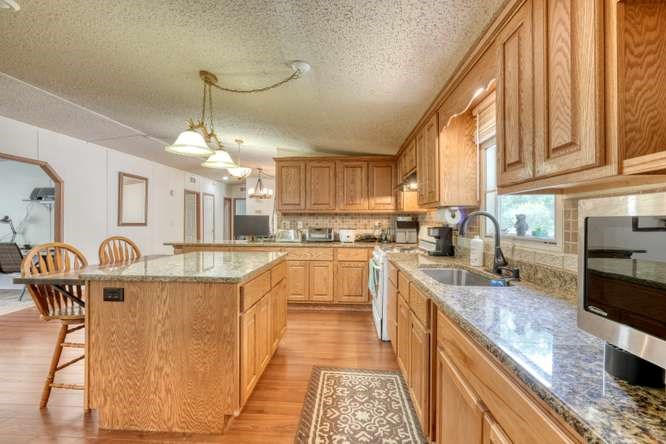 5359 Owltown Road Blairsville, GA 30512 - Photo 20 of 52 a large kitchen with lots of counter space cabinets and appliances