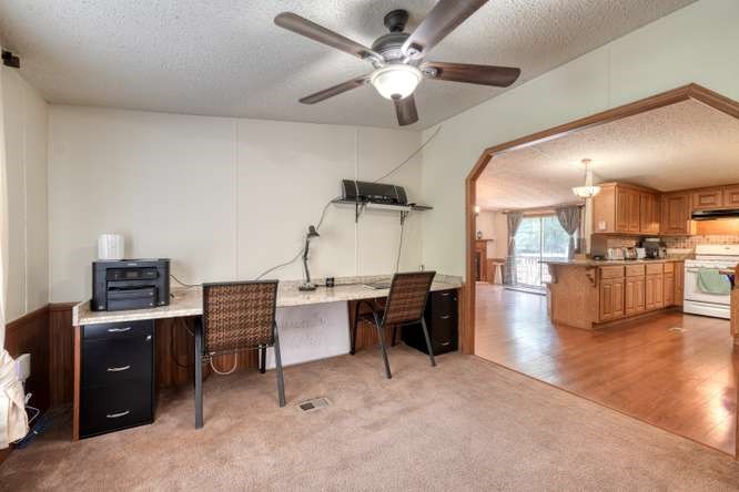 5359 Owltown Road Blairsville, GA 30512 - Photo 25 of 52 a view of a livingroom with furniture and a ceiling fan
