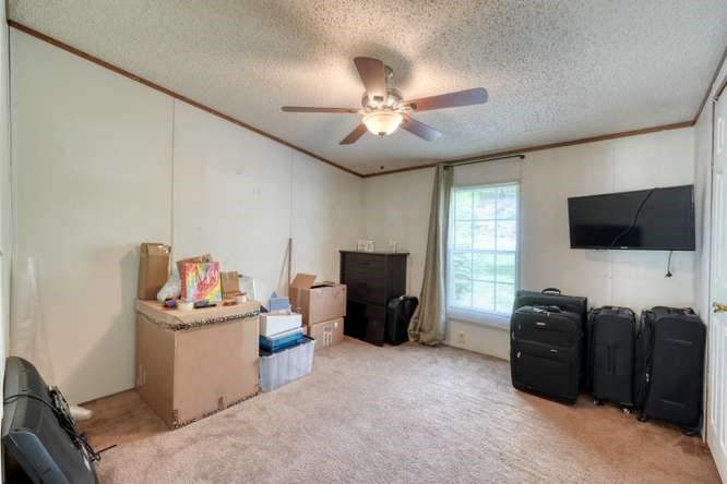 5359 Owltown Road Blairsville, GA 30512 - Photo 36 of 52 a view of a livingroom with furniture and a flat screen tv