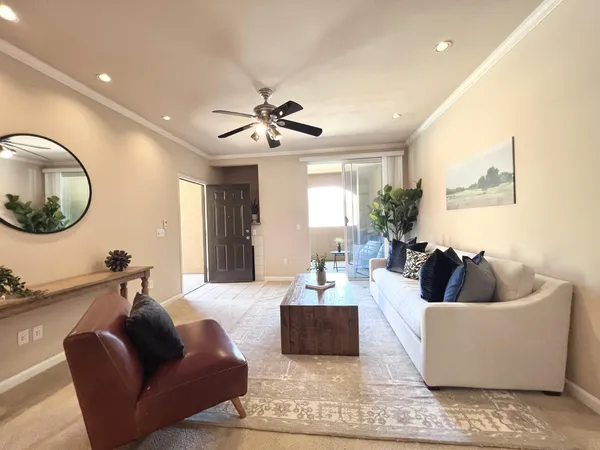 a living room with furniture and a large window