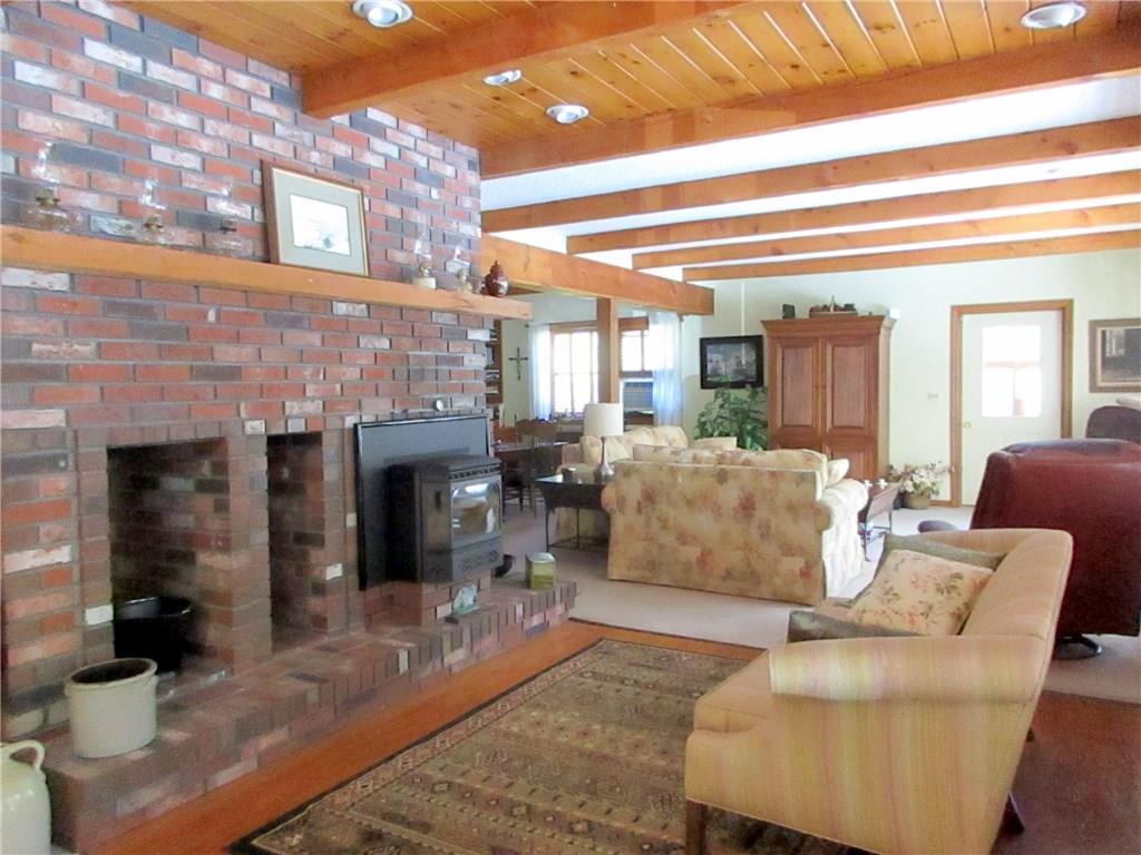650 Neck Road South China, ME 04358 - Photo 7 of 36 Living room with pellet stove and...