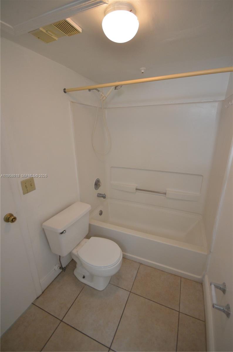 15201 Southwest 80th Street, Unit 207 Miami, FL 33193 - Photo 11 of 19 a bathroom with a toilet and a shower