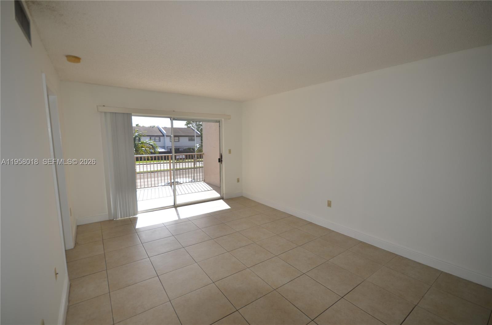 15201 Southwest 80th Street, Unit 207 Miami, FL 33193 - Photo 3 of 19 a view of an empty room and window