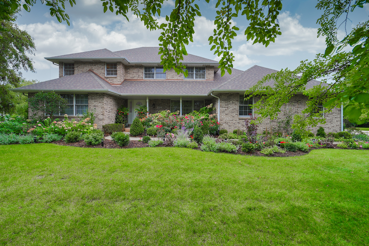 a view of a house with a garden