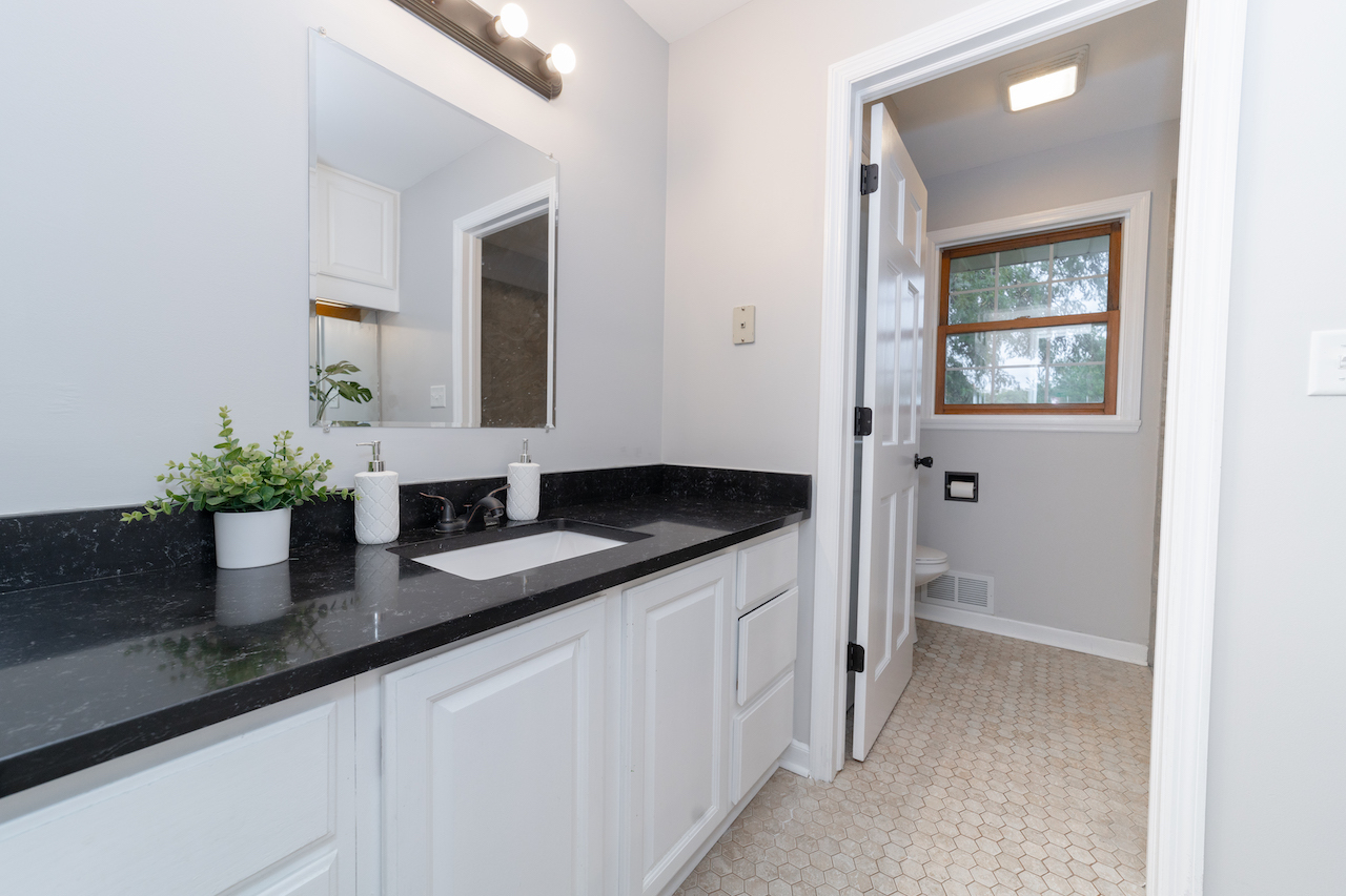 4818 5th Street Winthrop Harbor, IL 60096 - Photo 19 of 42 a bath room with sink and mirror