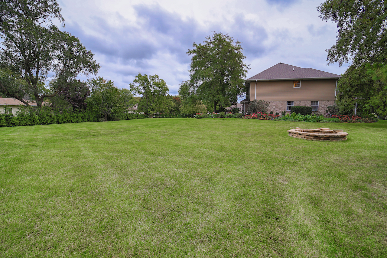 4818 5th Street Winthrop Harbor, IL 60096 - Photo 27 of 42 a front view of a house with garden