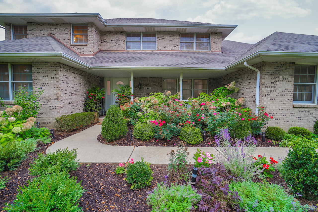 4818 5th Street Winthrop Harbor, IL 60096 - Photo 37 of 42 a front view of a building with a garden