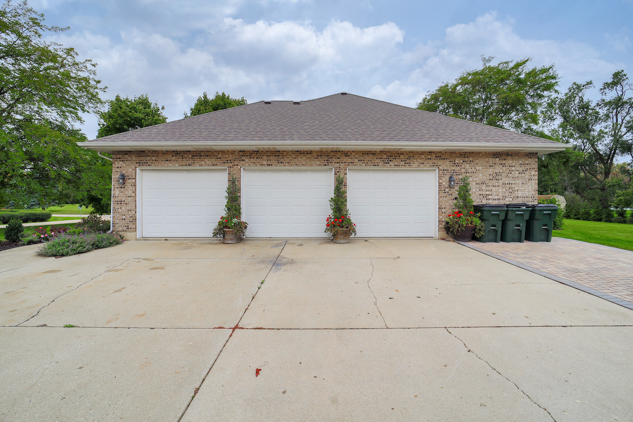4818 5th Street Winthrop Harbor, IL 60096 - Photo 40 of 42 a front view of a house with a yard and garage