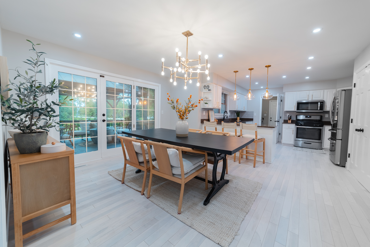 4818 5th Street Winthrop Harbor, IL 60096 - Photo 7 of 42 a dining room with furniture a chandelier and wooden floor