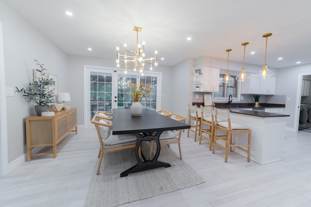 4818 5th Street Winthrop Harbor, IL 60096 - Photo 8 of 42 a view of a dining room and livingroom with furniture wooden floor a chandelier
