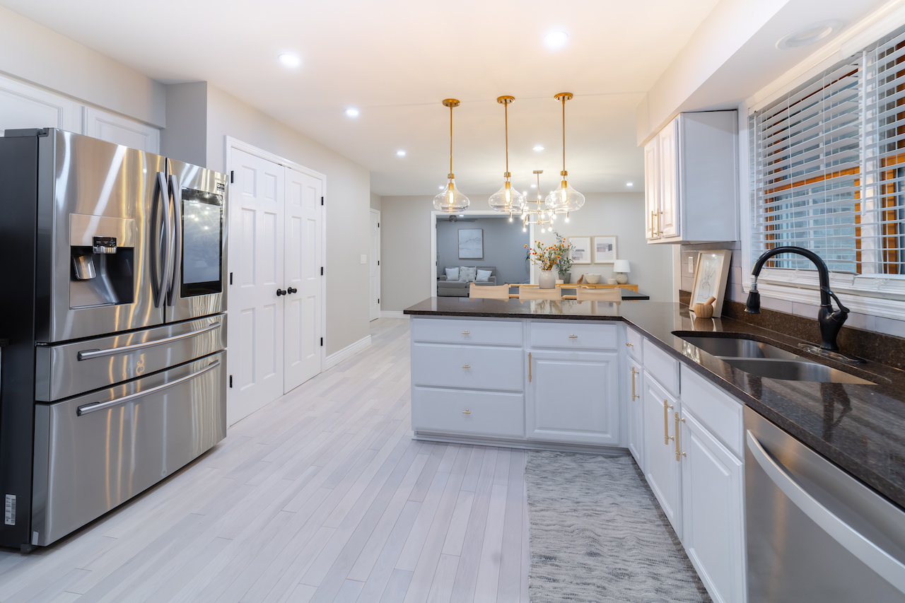 4818 5th Street Winthrop Harbor, IL 60096 - Photo 10 of 42 a kitchen with granite countertop a refrigerator and a sink