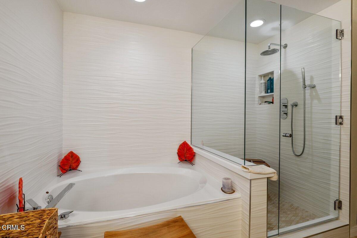 4322 Tradewinds Drive Oxnard, CA 93035 - Photo 16 of 30 a bathroom with a tub and shower