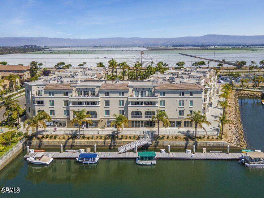 4322 Tradewinds Drive Oxnard, CA 93035 - Photo 3 of 30 a view of a water with tall buildings