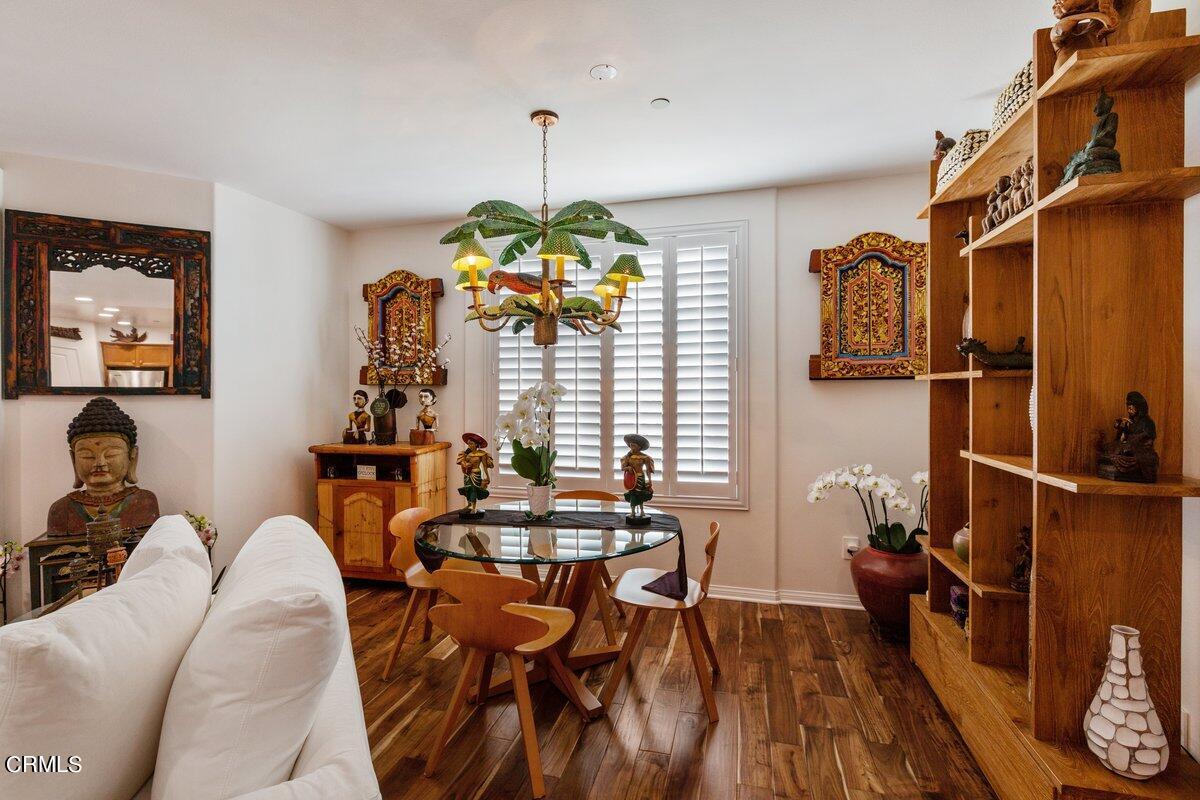 4322 Tradewinds Drive Oxnard, CA 93035 - Photo 6 of 30 a dining room with furniture a chandelier and wooden floor
