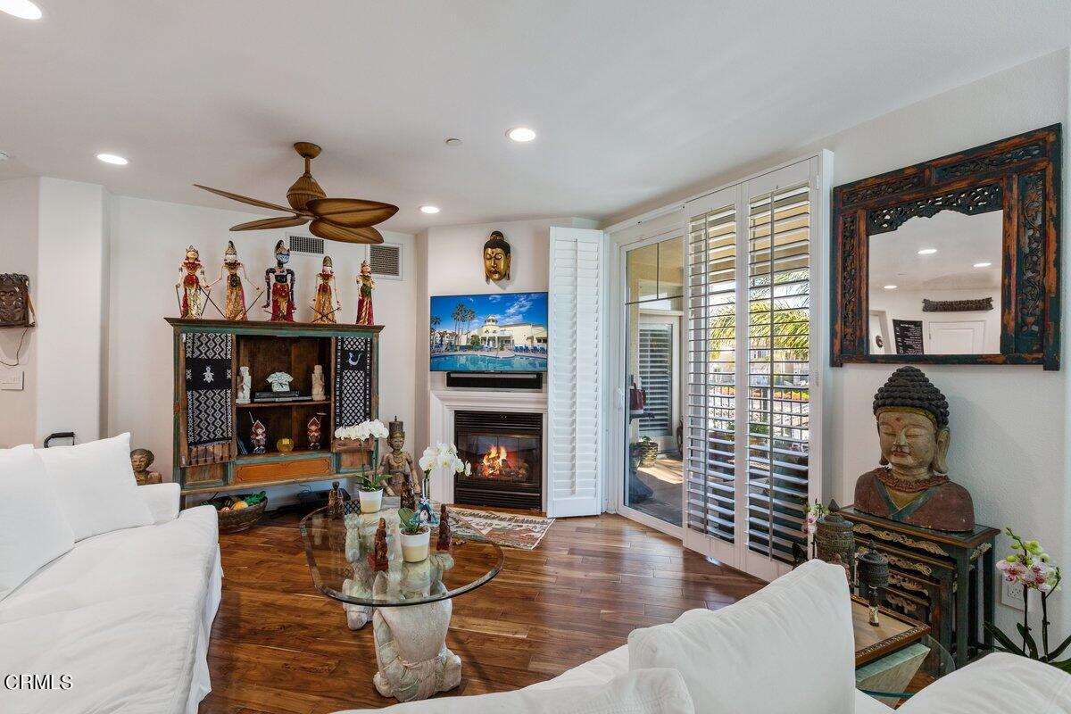 4322 Tradewinds Drive Oxnard, CA 93035 - Photo 7 of 30 a living room with fireplace furniture and a wooden floor
