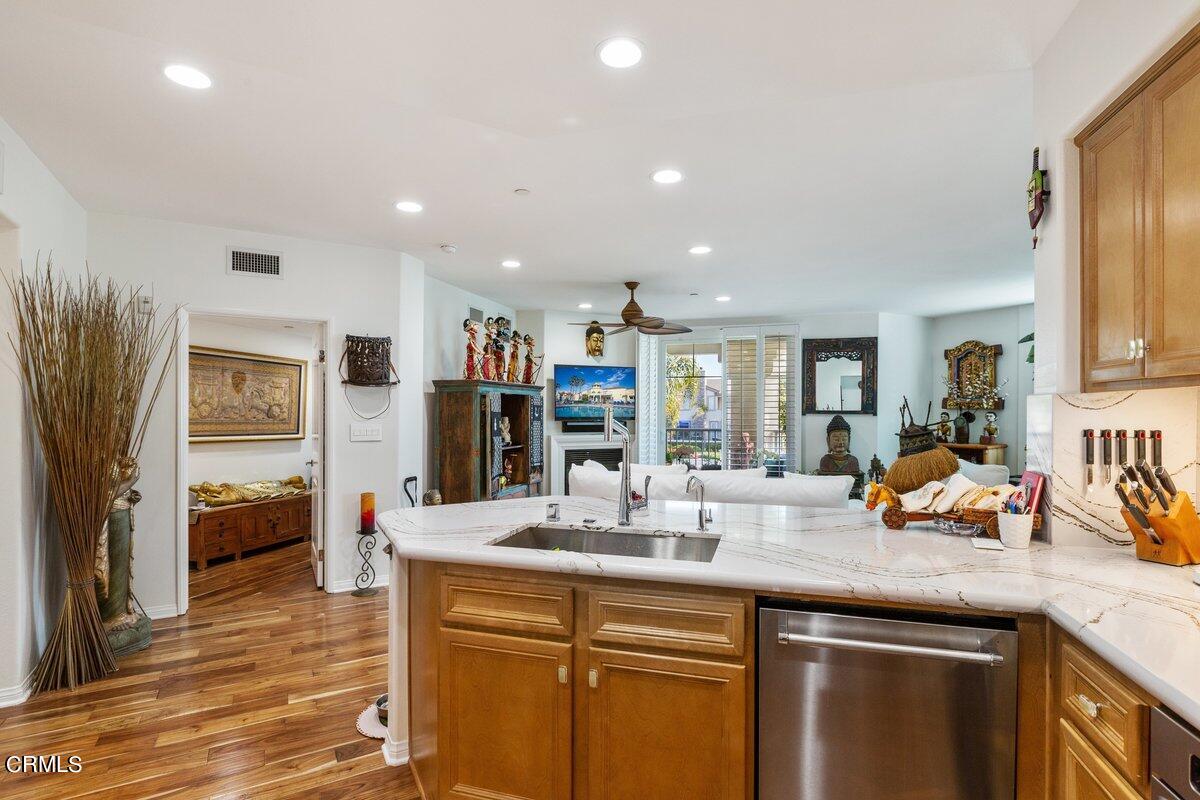 4322 Tradewinds Drive Oxnard, CA 93035 - Photo 9 of 30 a kitchen with stainless steel appliances granite countertop a sink stove and refrigerator