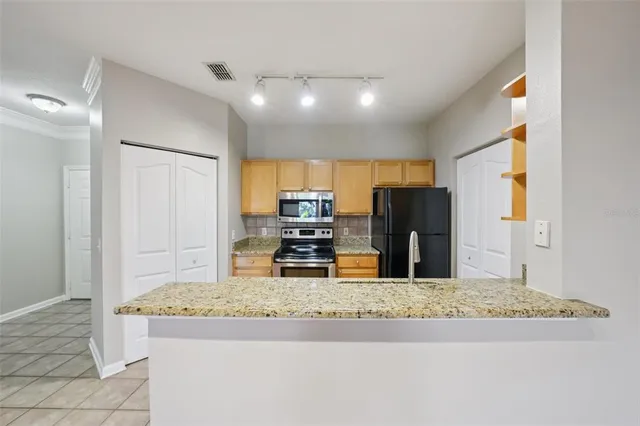 a spacious bedroom with a bed and a couch