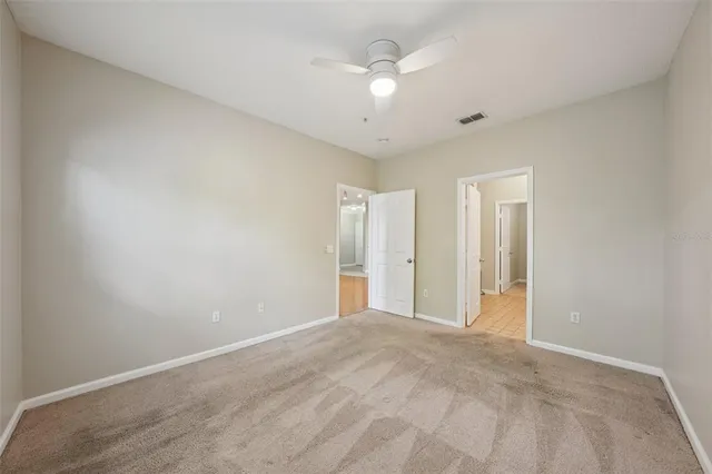 a spacious bathroom with a double vanity sink and a mirror