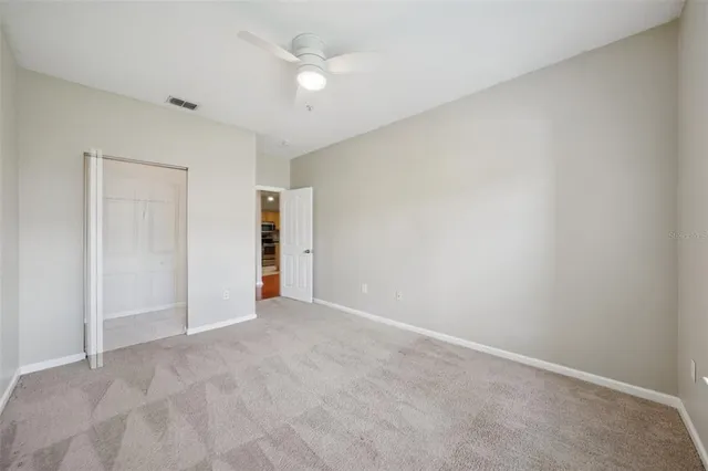 a view of an empty room with glass door