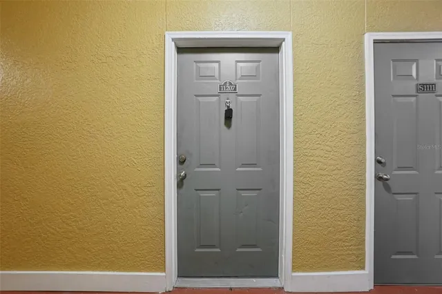 a view of an empty room with a window