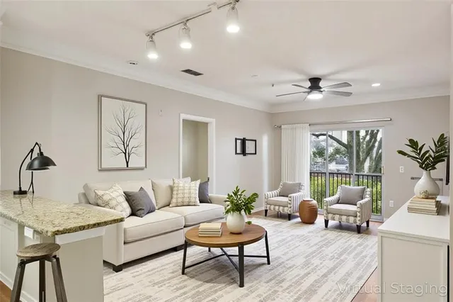 a living room with furniture and a large window