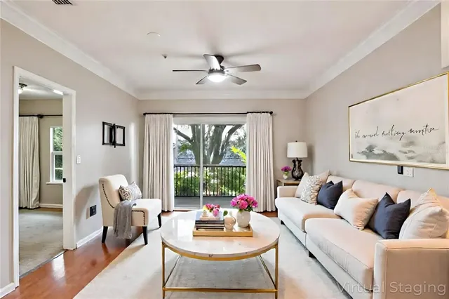 a view of an empty room and kitchen view