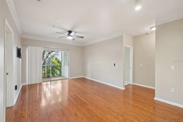 a view of a kitchen with a sink and wooden floor
