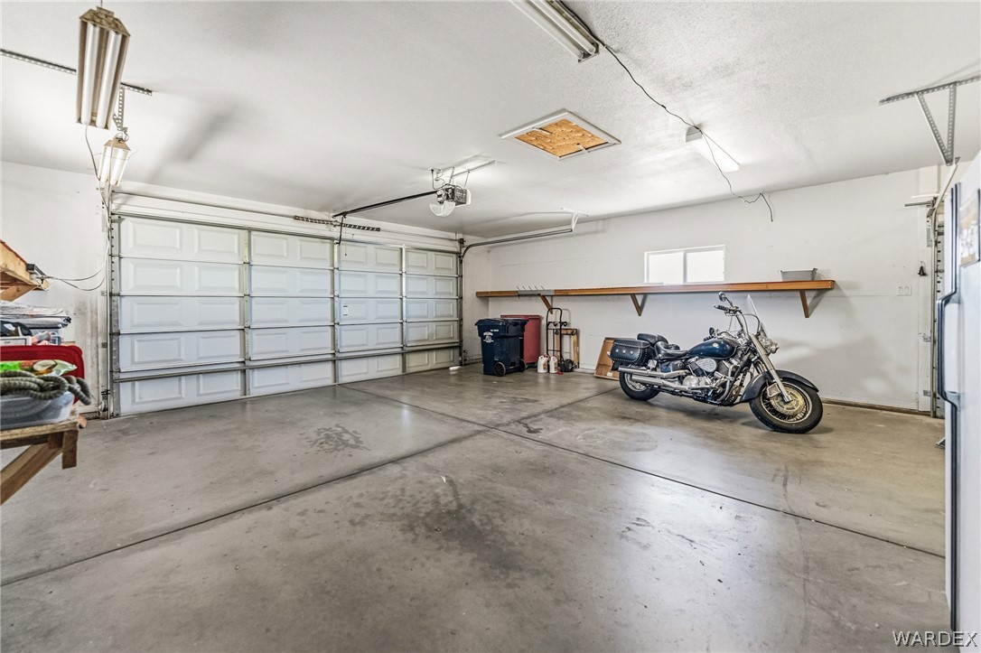 9332 Branded Road Kingman, AZ 86401 - Photo 39 of 44 a view of a garage with parked cars