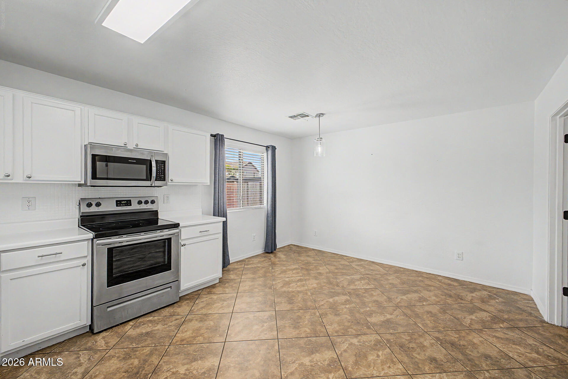 8337 West Payson Road Tolleson, AZ 85353 - Photo 17 of 44 Stove and eat in kitchen area
