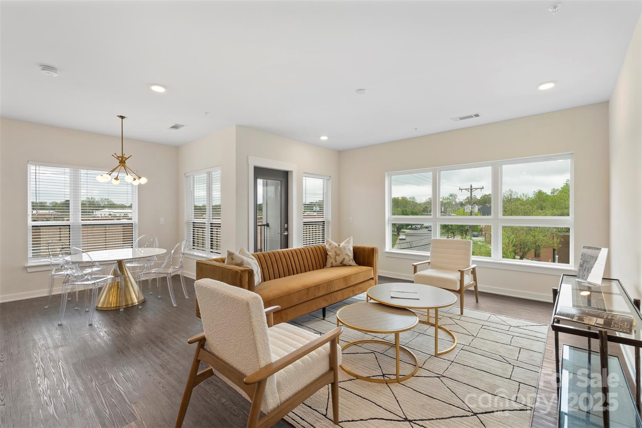 3630 North Davidson Street, Unit 3301 Charlotte, NC 28205 - Photo 13 of 33 a living room with furniture and large windows
