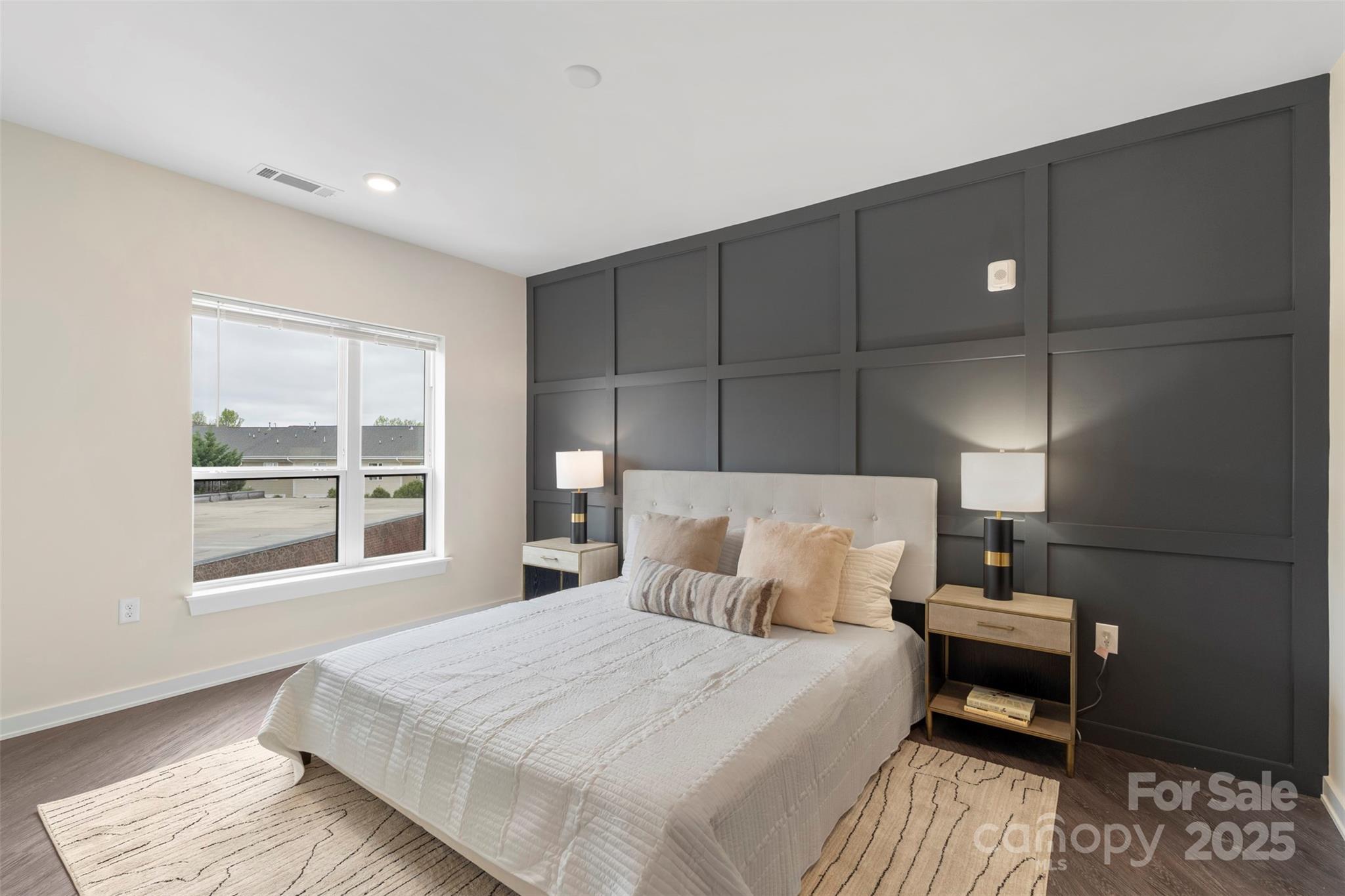 3630 North Davidson Street, Unit 3301 Charlotte, NC 28205 - Photo 15 of 33 a bedroom with a bed and a window