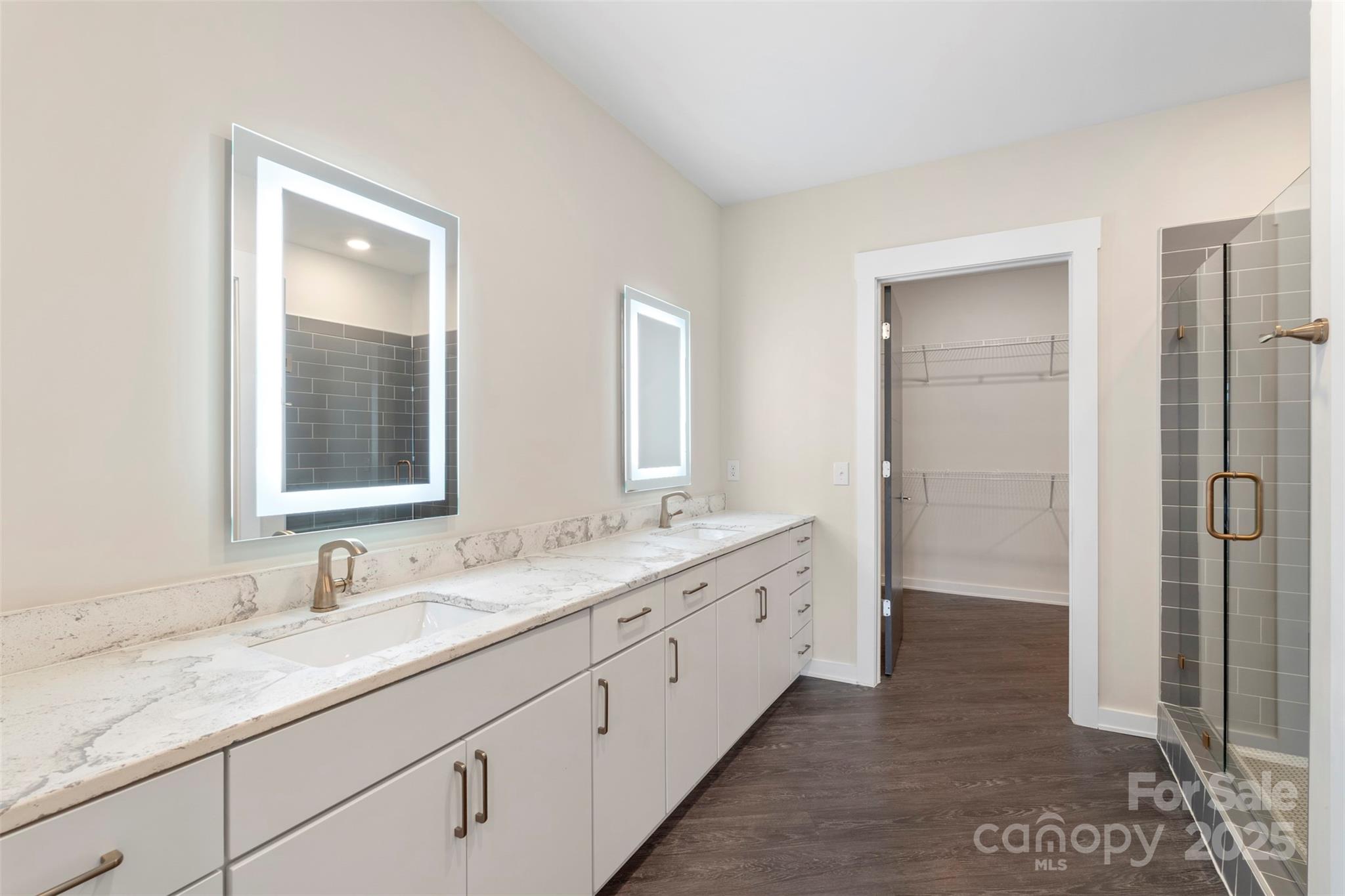3630 North Davidson Street, Unit 3301 Charlotte, NC 28205 - Photo 17 of 33 a bathroom with double sink and a mirror