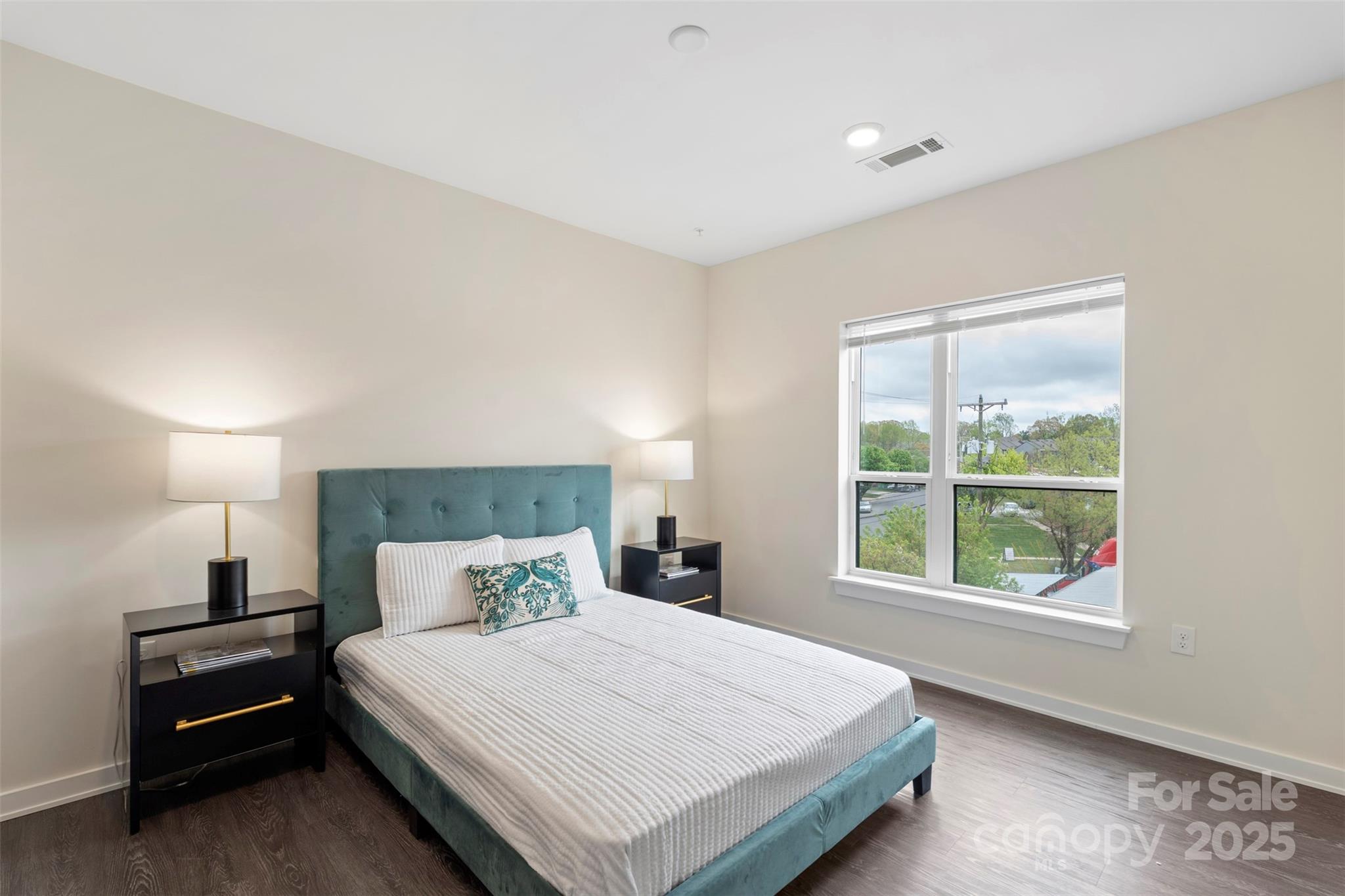 3630 North Davidson Street, Unit 3301 Charlotte, NC 28205 - Photo 22 of 33 a bedroom with a bed and a window