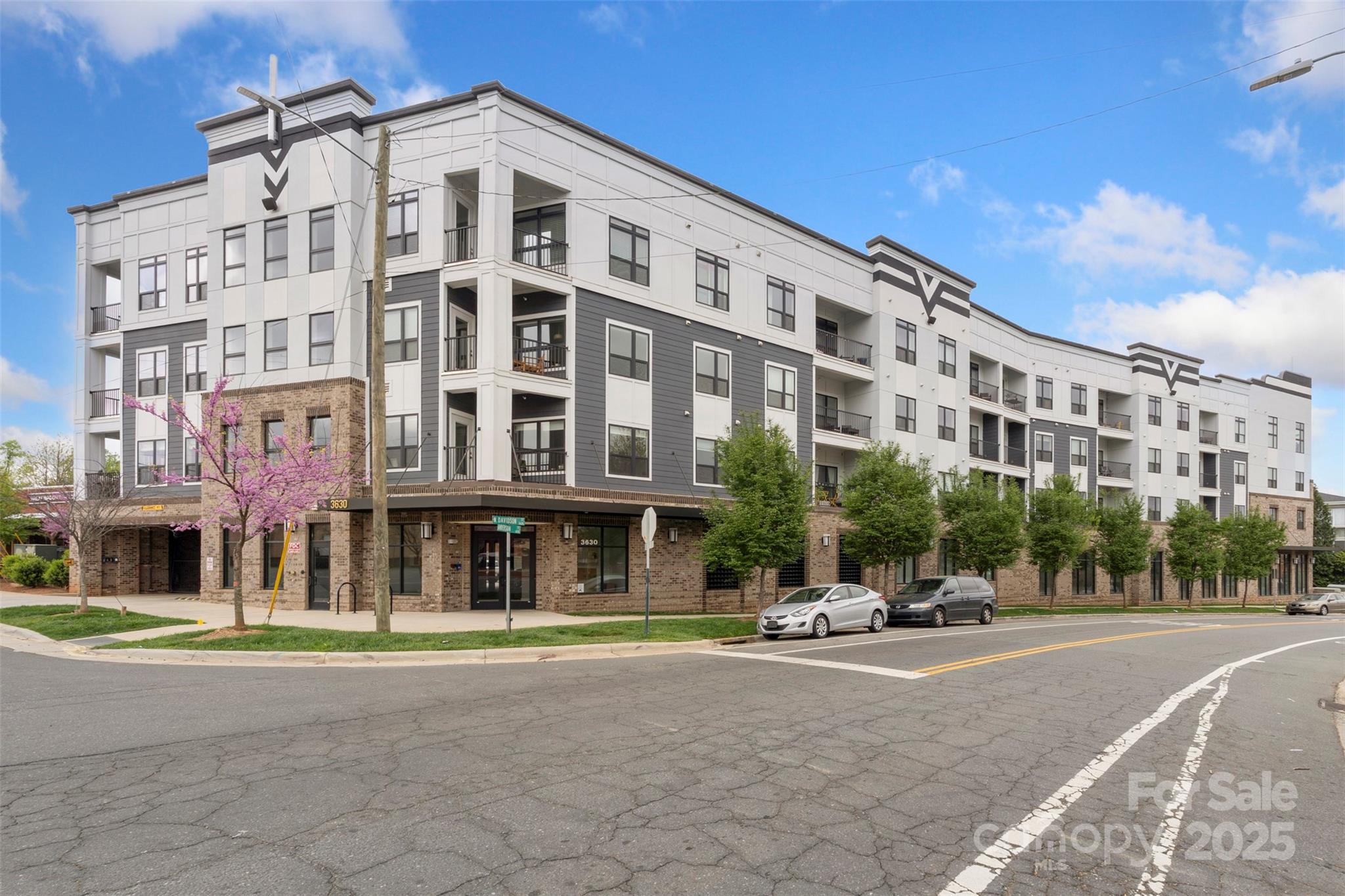 3630 North Davidson Street, Unit 3301 Charlotte, NC 28205 - Photo 32 of 33 a building with a lots of windows