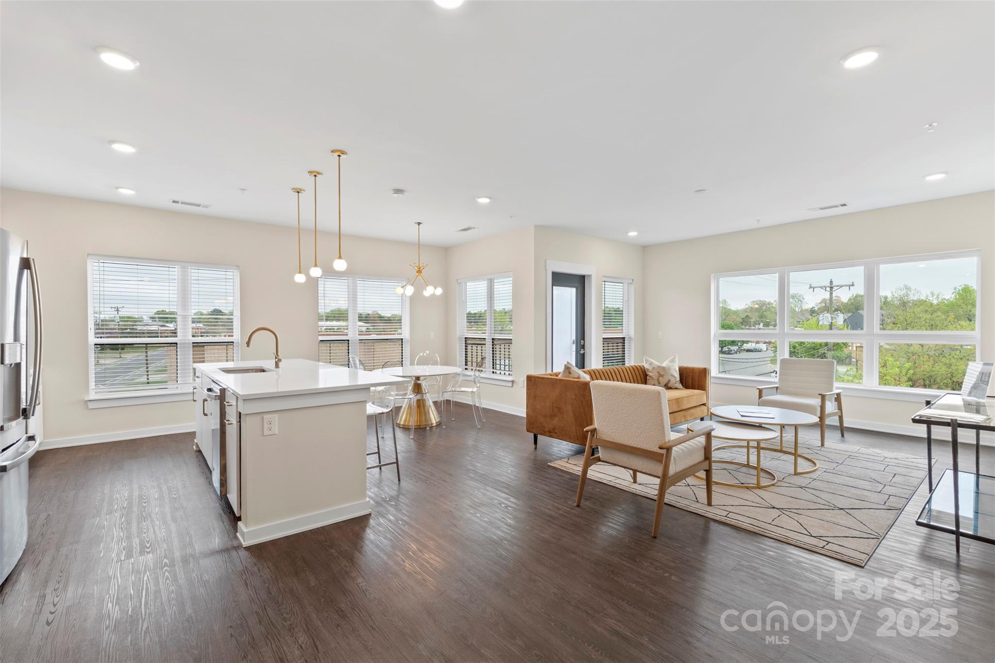 3630 North Davidson Street, Unit 3301 Charlotte, NC 28205 - Photo 5 of 33 a living room with furniture and large windows