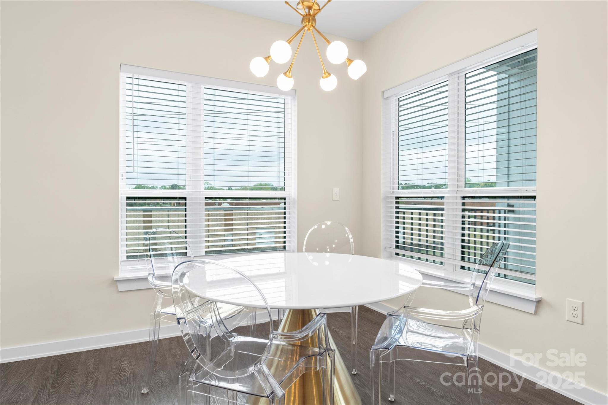 3630 North Davidson Street, Unit 3301 Charlotte, NC 28205 - Photo 9 of 33 a view of a dining room with furniture and wooden floor