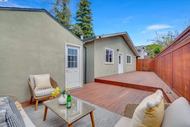 a outdoor space with a table and chairs