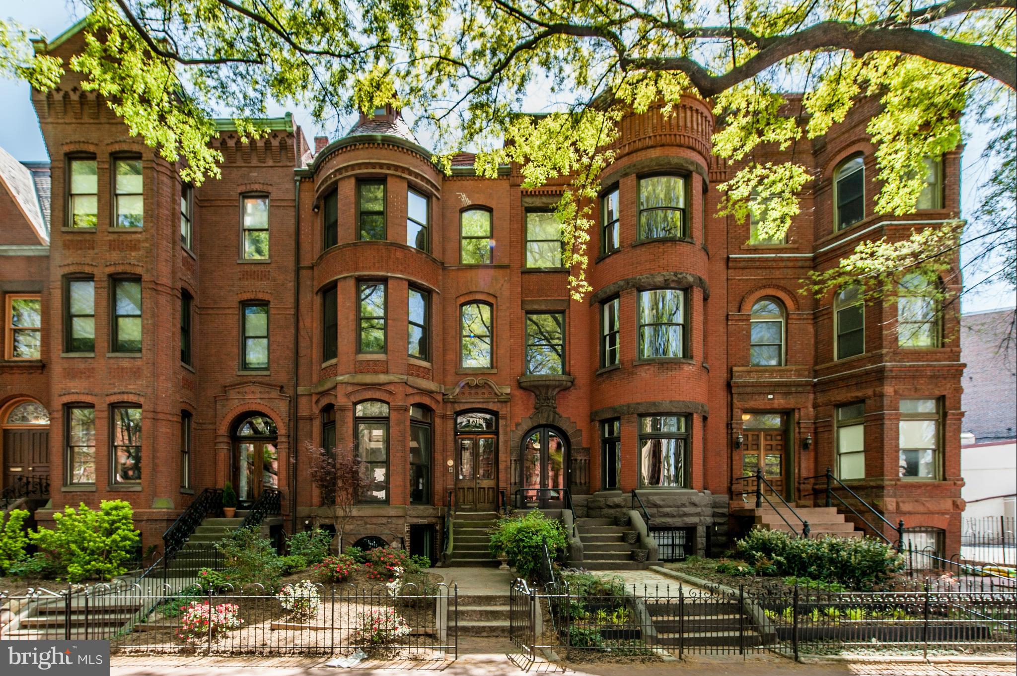 1318 Rhode Island Avenue Northwest Washington, DC 20005 - Photo 1 of 25 a front view of a residential apartment building with a yard