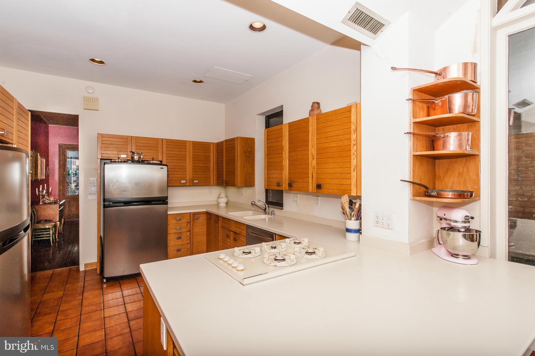 1318 Rhode Island Avenue Northwest Washington, DC 20005 - Photo 11 of 25 a kitchen with stainless steel appliances a refrigerator and a stove