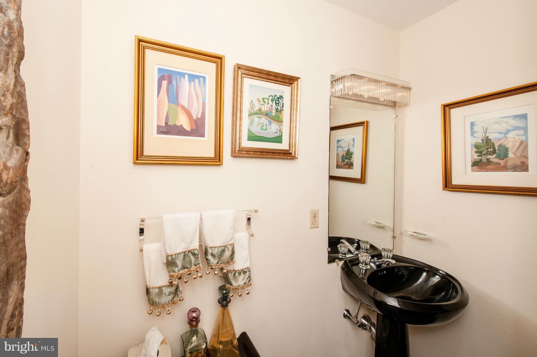 1318 Rhode Island Avenue Northwest Washington, DC 20005 - Photo 12 of 25 a bathroom with a sink and a mirror