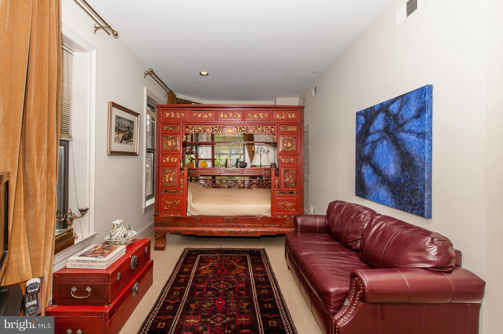 1318 Rhode Island Avenue Northwest Washington, DC 20005 - Photo 18 of 25 a living room with furniture and a rug
