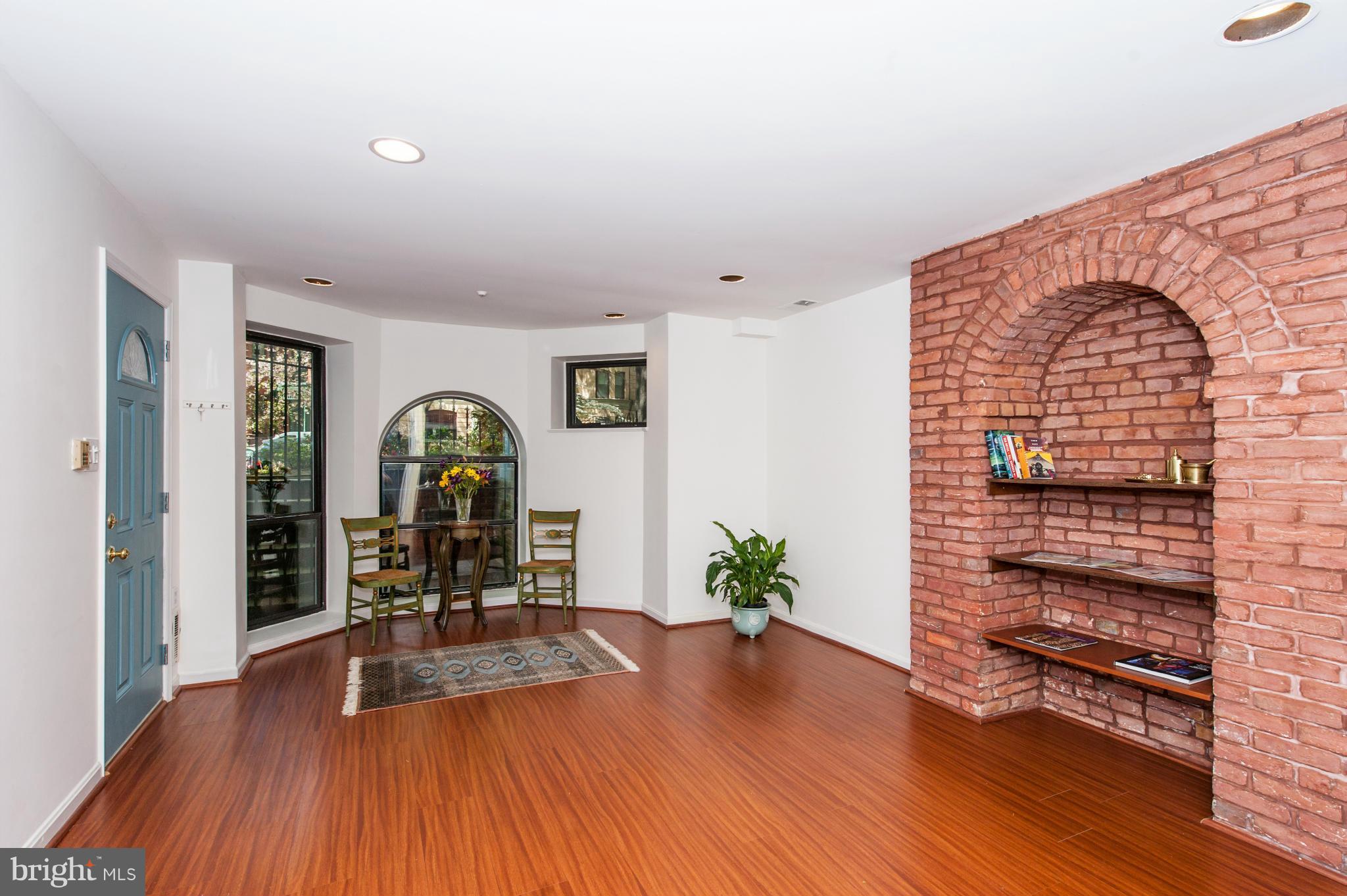 1318 Rhode Island Avenue Northwest Washington, DC 20005 - Photo 24 of 25 a view of a livingroom with furniture and wooden floor