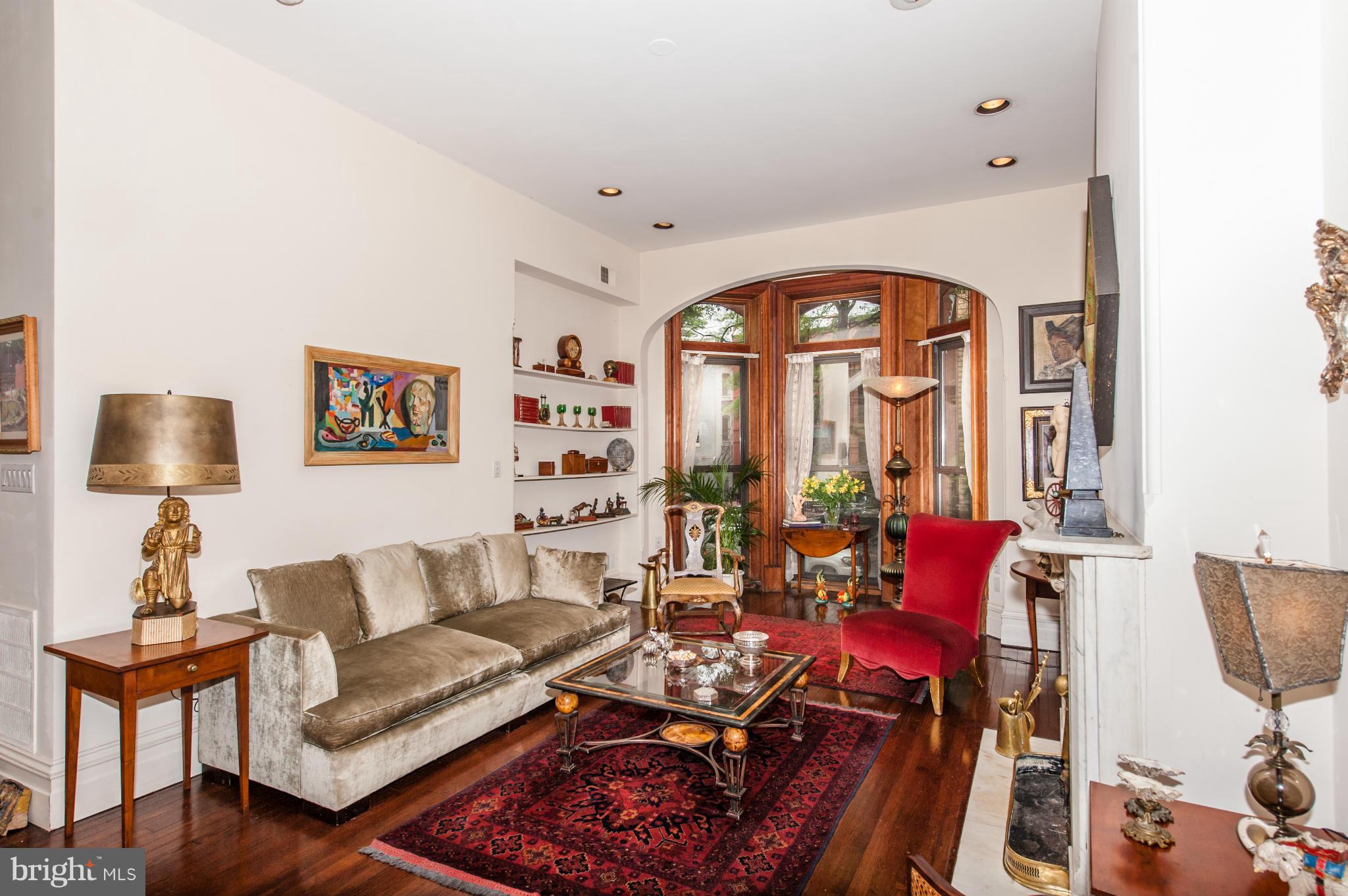 1318 Rhode Island Avenue Northwest Washington, DC 20005 - Photo 6 of 25 a living room with furniture and a large window